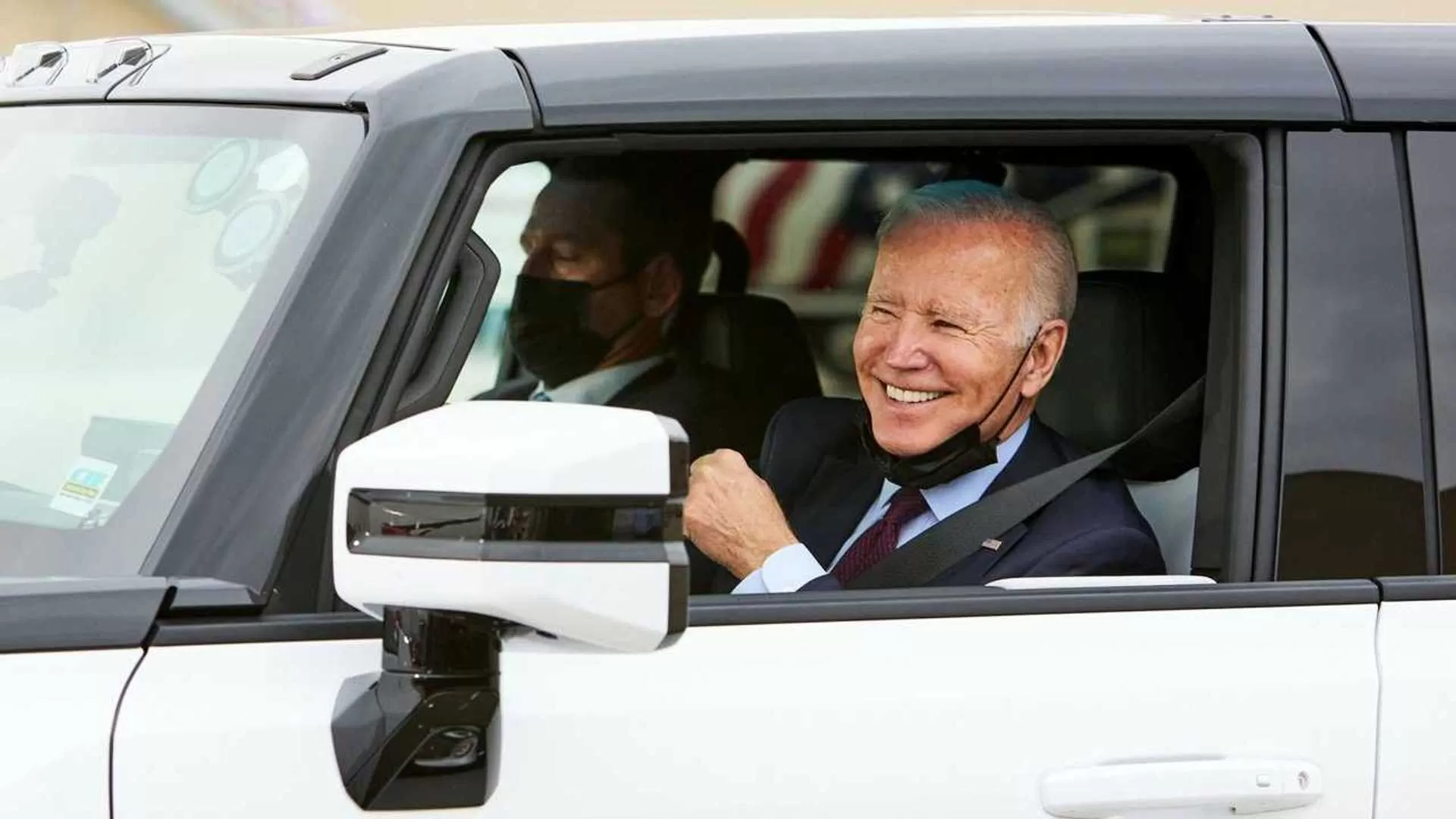 e-biden-test-driving-the-2022-gmc-hummer-ev-pickup.webp