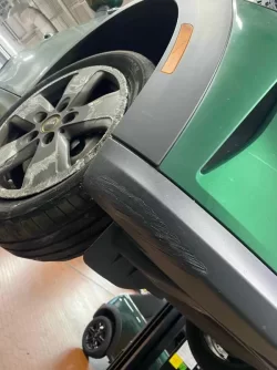 bumper and drivers side tire.webp